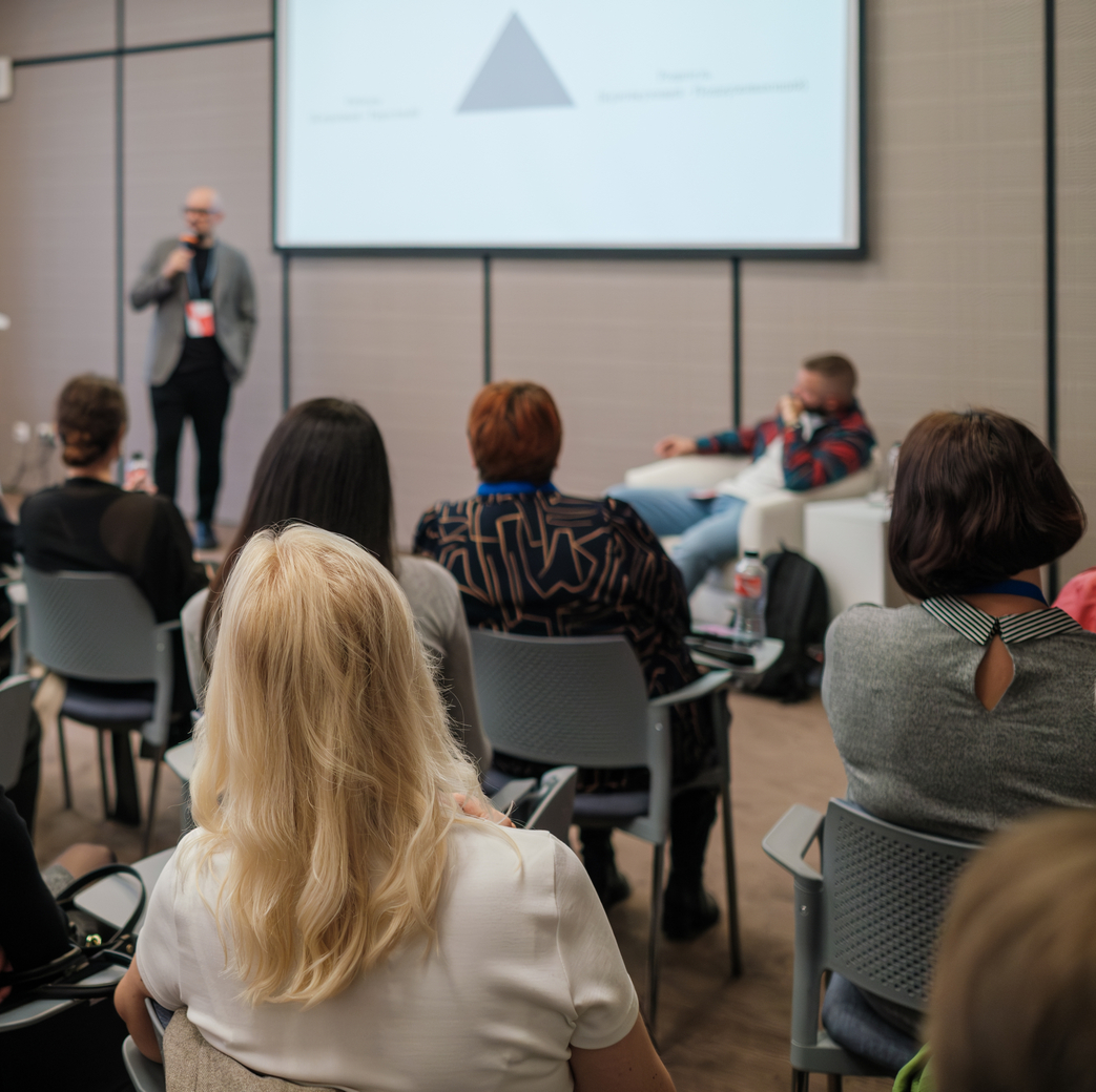 Business,Seminar,,Speaker,Presenting,To,Engaged,Audience,In,Conference,Room,
